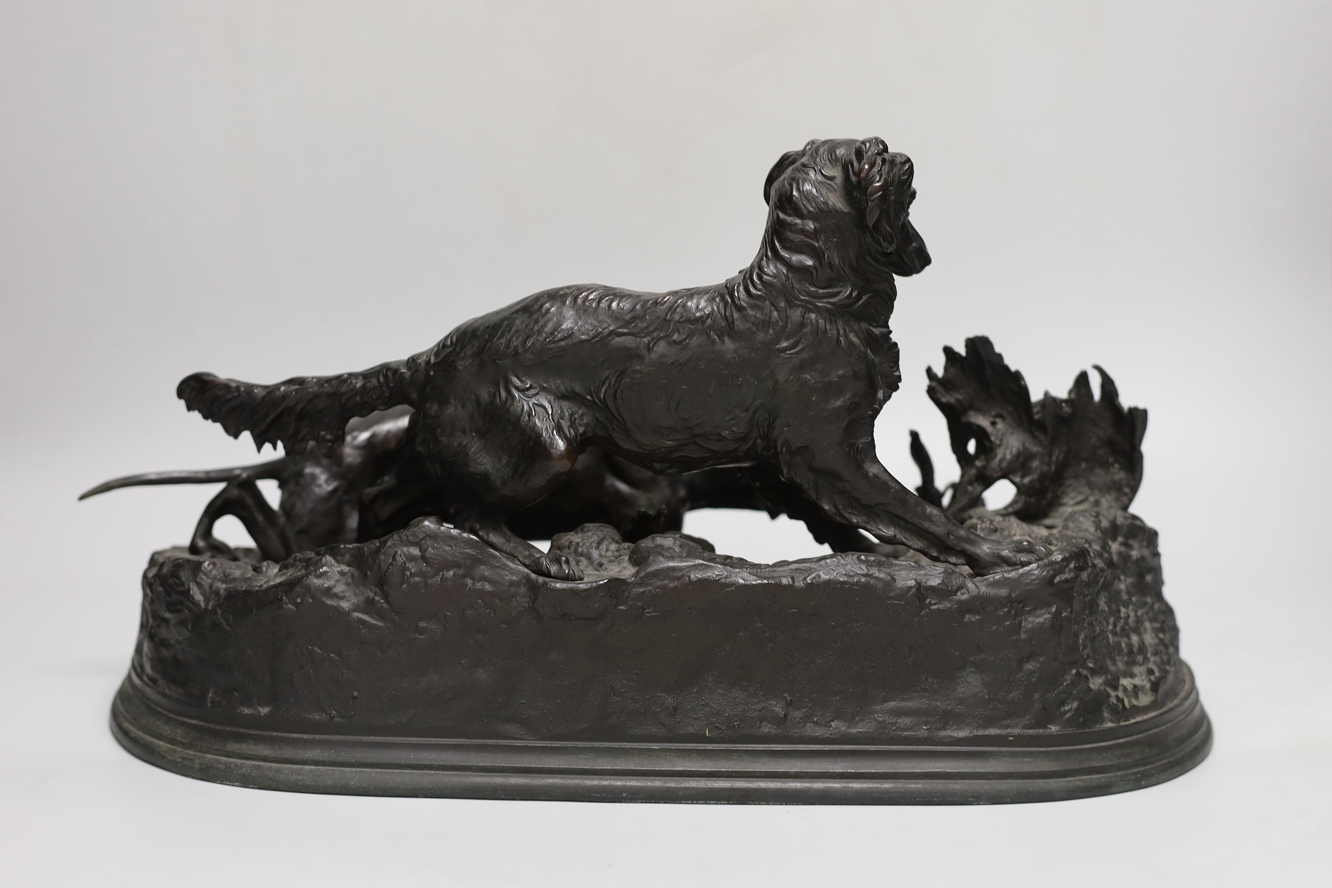 After Pierre-Jules Mêne (1810-1879). A bronze group of hounds and a quail, 39cm